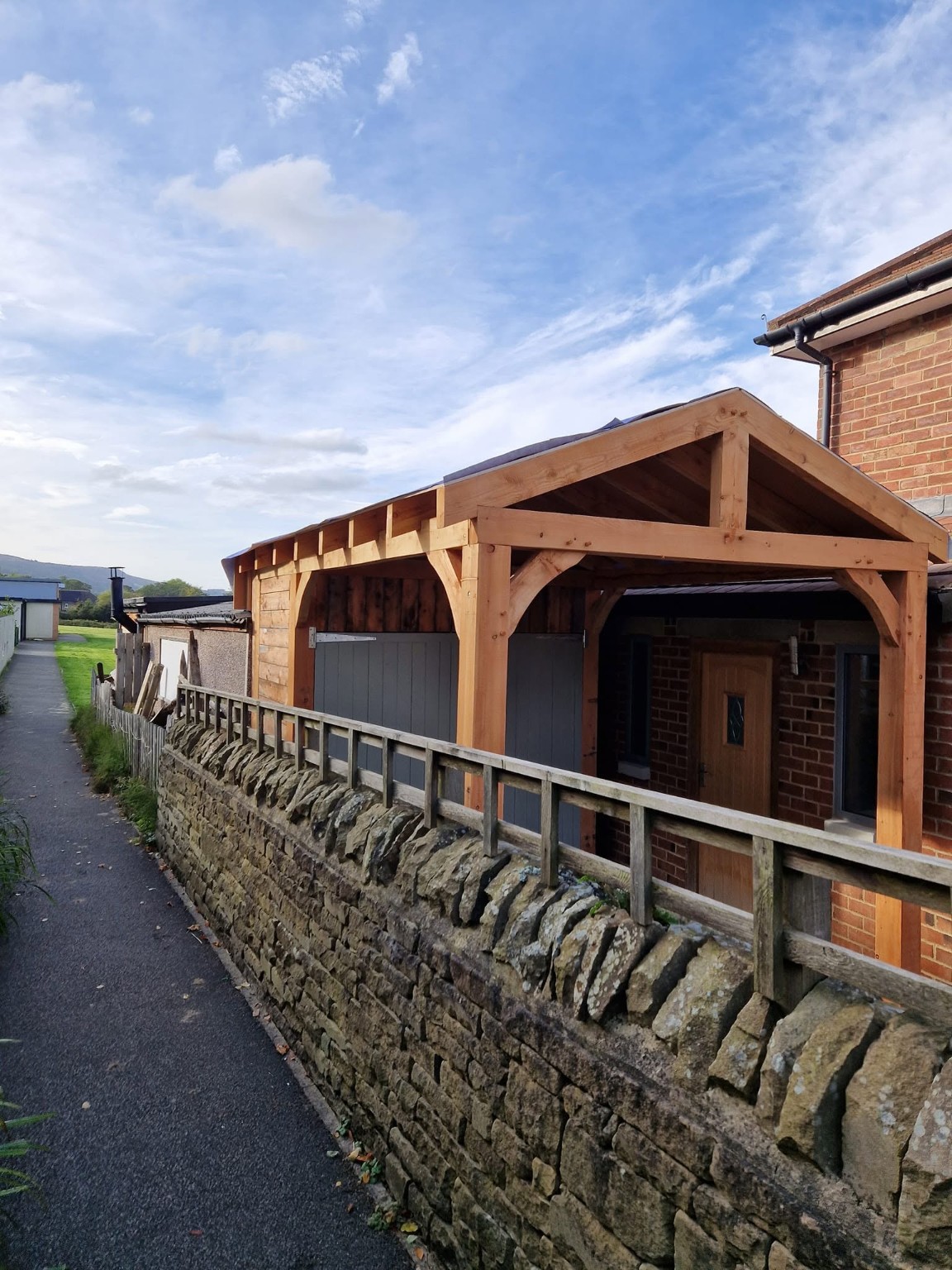 Large bespoke oak porch and covered entrance by Pinehurst Joinery